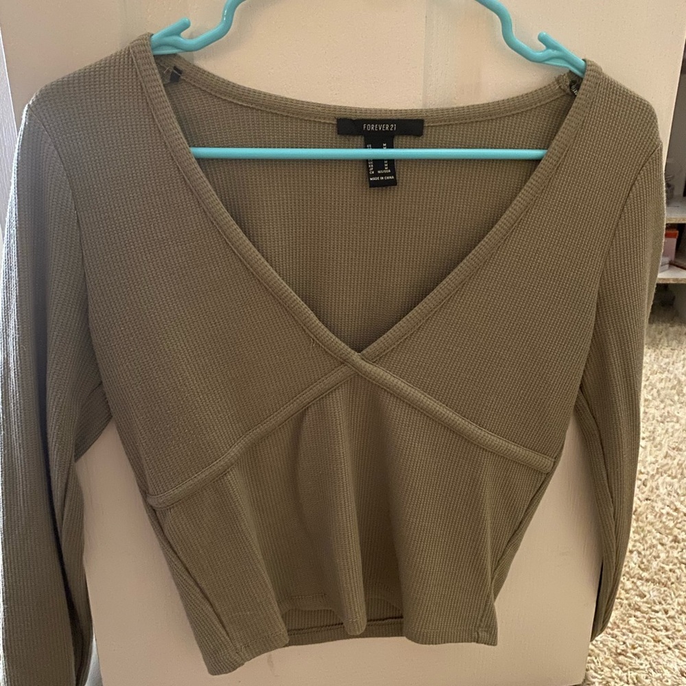 forever 21 army green long sleeve. a little cropped and tight fitting.